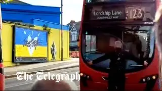 Rail strikes: Man blocks a bus from moving as a queue builds outside train station
