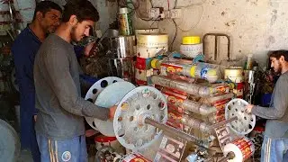 A Young Skilled Worker Operating Plastic Packing Roll Machine | Wrapping Machine Handling Skills