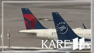 Delta planes clip wings at MSP