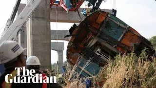 Smoke billows from passenger train after crane collapse killed at least 22 people