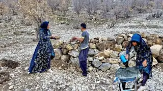 A mother works in the mountains to pay for the land.
