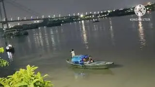 The Hooghly River at night glows with magical lights and peaceful vibes & reflecting  true beauty.