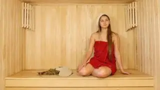 Girl in Red Towel in Sauna