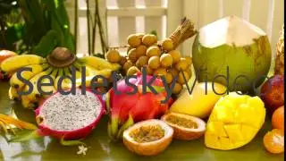 Exotic tropical fruit on table. Dolly shot