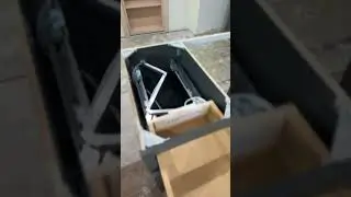 Articulated wire loom for in-drawer power system.