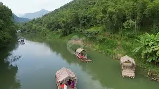 Bamboo rafting on a stream at Pu Luong Nature Reserve