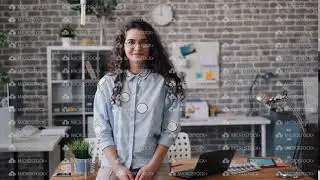 Portrait of pretty girl entrepreneur standing in office alone and smiling