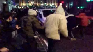 Demonstrators attack police car in Oslo