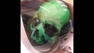 Airbrushing skulls on a gas tank