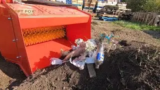 Screening garbage out of soil and compost. Fast and efficient.