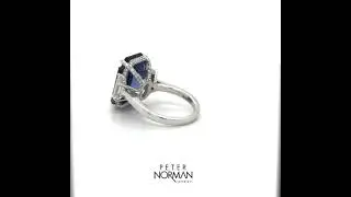 Custom emerald cut sapphire with trapezoid diamonds handcrafted in platinum