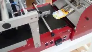 SAVEMA Feeder Conveyor Belt and SVM 32I Printing and Feeding with BIC Cartons