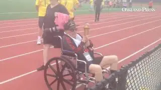 Fred Winter, 101, of Holland was torch bearer for Senior Olympics and Jon Fruytier competes in hamme