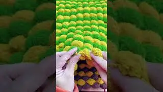Knitting blankets with pom pom yarn