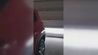 VIDEO | Buffalo resident opens garage door to several feet of snow