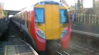 UK: Winnersh, 2 x South West Trains Class 458 'Juniper' EMUs depart on a Reading to Waterloo service