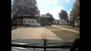 My bumbling neighbor tries to reverse a camper in her driveway