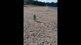 Alma chasing her beach ball