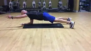 Prone plank with alternating arm extension