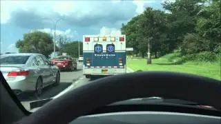TRANSCARE EMS AMBULANCE RESPONDING ON WEST SIDE HIGHWAY ON WEST SIDE OF MANHATTAN, NEW YORK CITY.