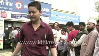 Bank infrastructure heavily strained, as millions of Indians stand in long queues