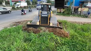Specialist Performs fill Huge Land by use Power Dozer with Big Dump Truck