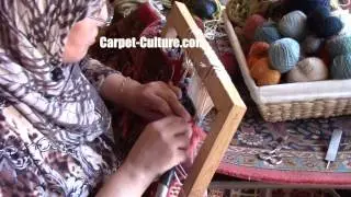 Restoring the corner of an Antique Rug at Carpet Culture in Soho