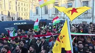 Police officers pushed and kicked protesters in london kurdish