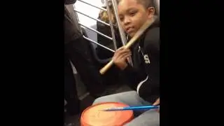 Young comedian / drummer on NYc subway