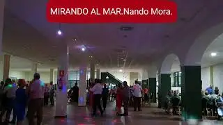 Mirando al mar.Nando Mora