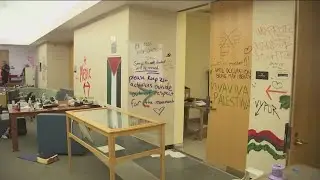 Graffiti, broken ceiling tiles seen inside Portland State library from protest