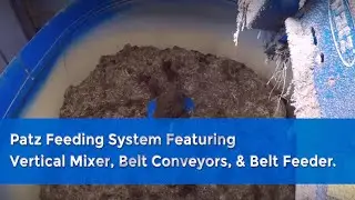 Patz Feeding System featuring a Stationary Vertical Mixer, Belt Conveyors, and Belt Feeder.