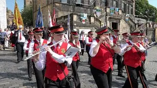 Linlithgow Reed Band lead Civic party march down from Palace during 2023 Linlithgow Marches