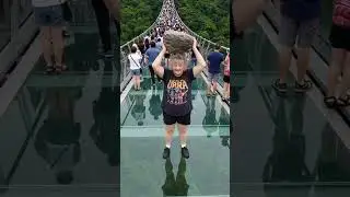 This dumb old lady was angry so she broke the glass bridge