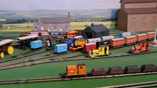 Bachmann Rusty pulling 4 Brown 4 grey slate wagons and red box van