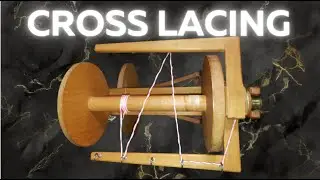 Learn how to cross lace an Irish tension spinning wheel. Excerpt from Spinning Consistent Singles