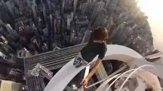 Russian teenagers dangling at the top of a Hong Kong skyscraper