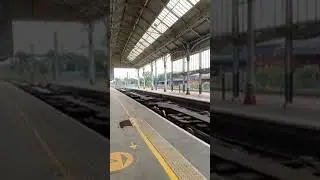 DB 66192 running through Preston with a train of container cars, empty apart from 2 tanks. 26/6/2025