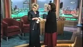 Bette midler showing Rosie O'Donnell how to do the poi balls