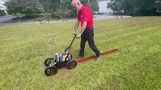 Wide handle, large wheel aerosol spray machine for line marking soccer, football, baseball fields.