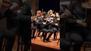 Seany playing violin in Worcester Youth Symphony Orchestra 6/20/2023