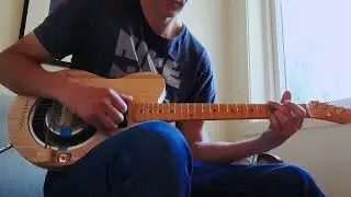 Homemade Dogbowl resonator guitar with piezo om the cone.