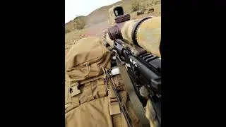 Prone. Behind the ruck. Every round deliberate.