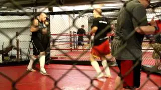 Lee The Beast Beane and Travis Lerchen doing some slow fighting in the cage..