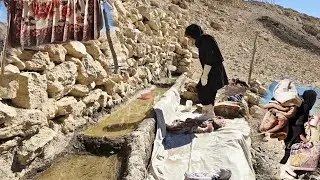 The hardships of nomadic life: washing clothes in pristine nature and by a spring