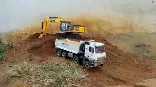 NEW EXCAVATOR CAT WORKING 1999 UPDATE