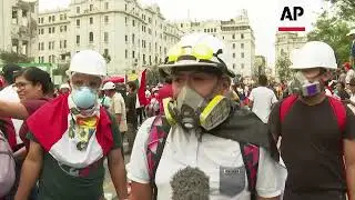 Volunteers neutralize gas canisters in Peru protests