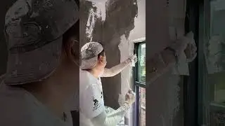 Renovation workers plastering a white wall#workersskills