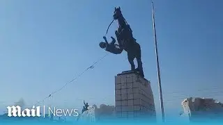 Syrian rebels tear down statue of Bashar al-Assad's brother
