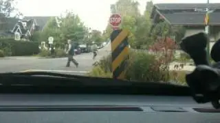 bikes ignore a stop sign and pedestrians